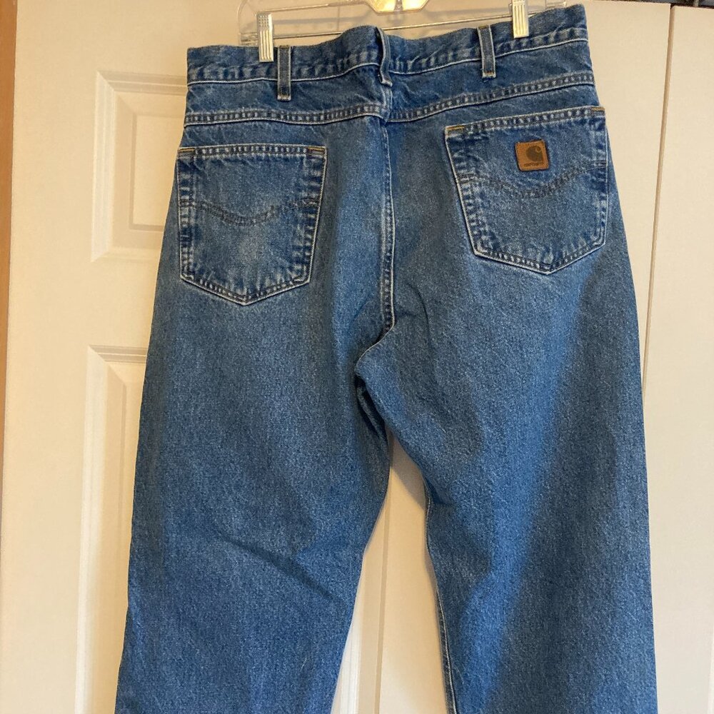 Carharrt Jeans men's marked 38x30 measures 37" waist, 29" inseam, 12 5/8" Rise.